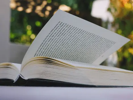 Open book representing prose fiction for ACT online coaching reading practice